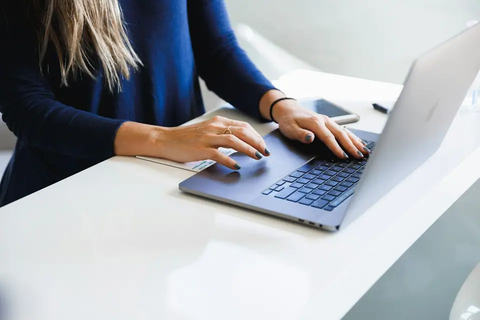 Sample profile photo: a support agent on her laptop