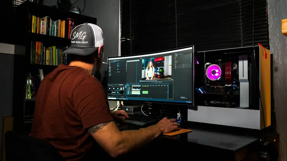 Sample profile photo: a video editor at his computer