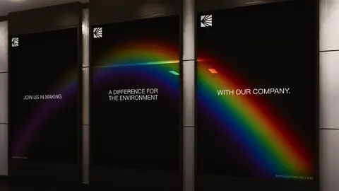 Dark Earthpure posters in a hall with a rainbow of light crossing them.