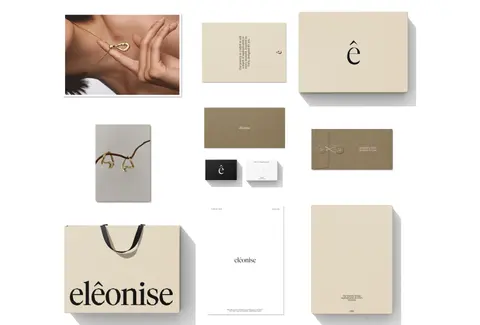 A flat lay of elēonise cards, a shopping bag, a pouch and a poster on a cream ground.