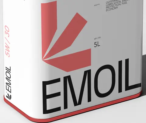 Close view of a white Emoil oil tin with a red band and a red leaf mark.