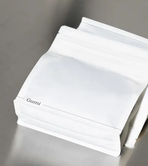 Plain white Gumi coffee pouch.