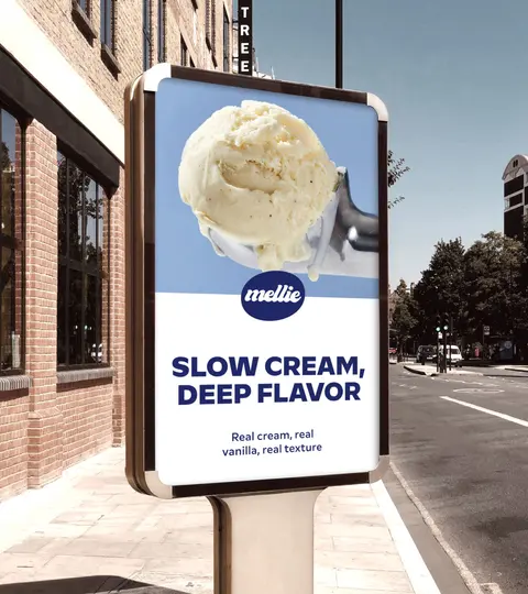 A Mellie street-side advert panel with a scoop of ice cream and the line Slow cream, deep flavour.