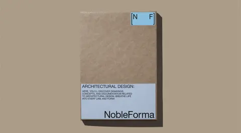 A kraft NobleForma box with architectural design printed on the front, on sand.