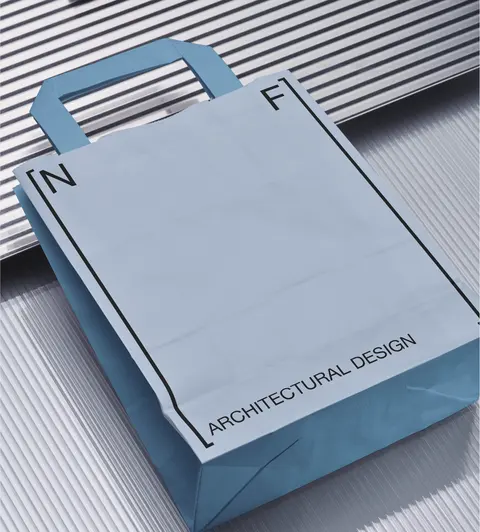 Pale blue paper carry bag with N and F corner marks.